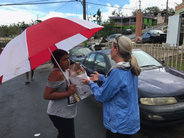 11-12-2017 Sheila offers various items to this young representative of a family