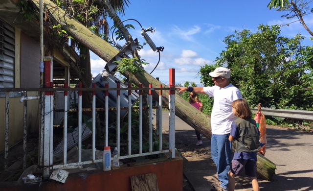 11-25-2017 While island authorities await electrical poles to replace those that were downed, these homeowners await the removal of this pole from its resting place on their porch after it was thrown down by María